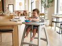 AI Generated Toddler in Restaurant Baby Feeding Chair